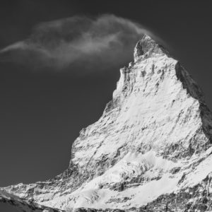 The peak of the The Matterhorn - black and white images of mountains in the clouds in 