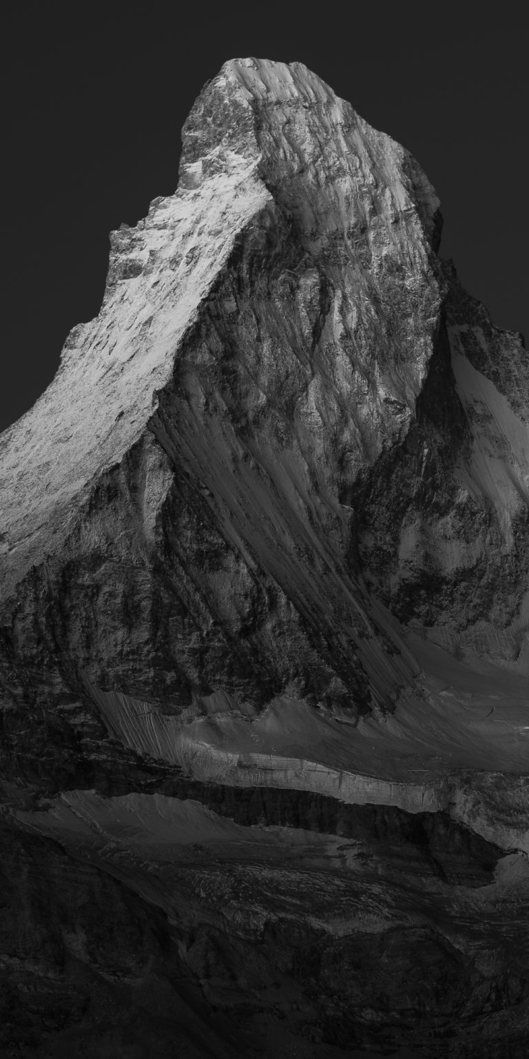 The Matterhorn Matterhorn - Black and white landscape image of rocky and snowy mountain in the Swiss Alps - Vertical mountain