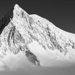 Black and white mountain photography Aletschhorn- summit emerging from the sea of clouds